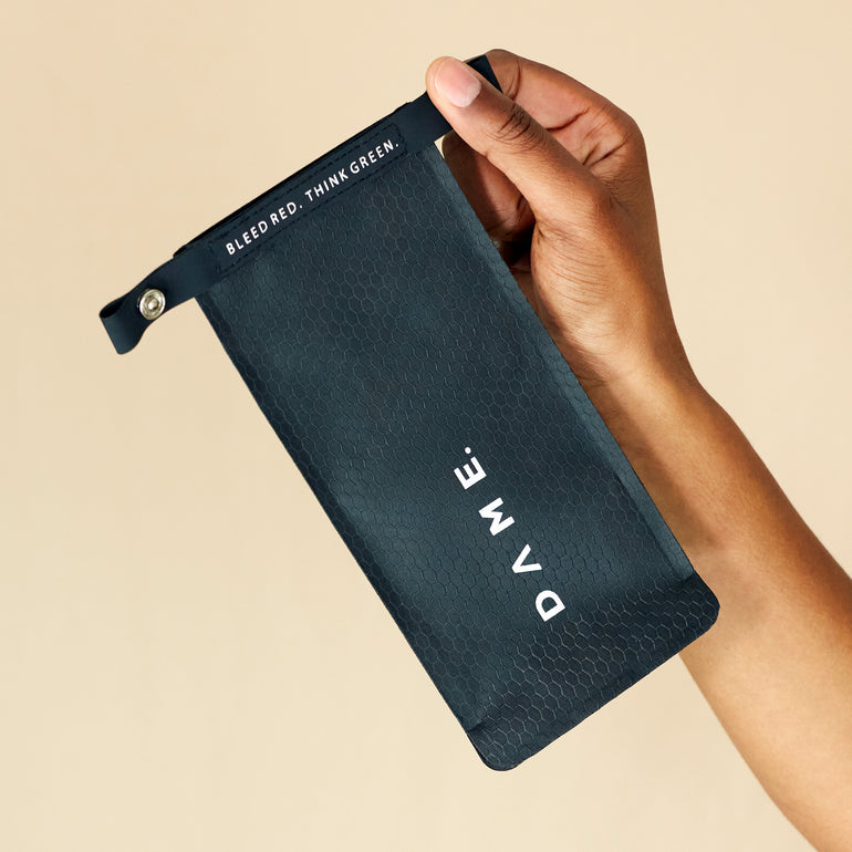 Hand holding DAME's Dry bag