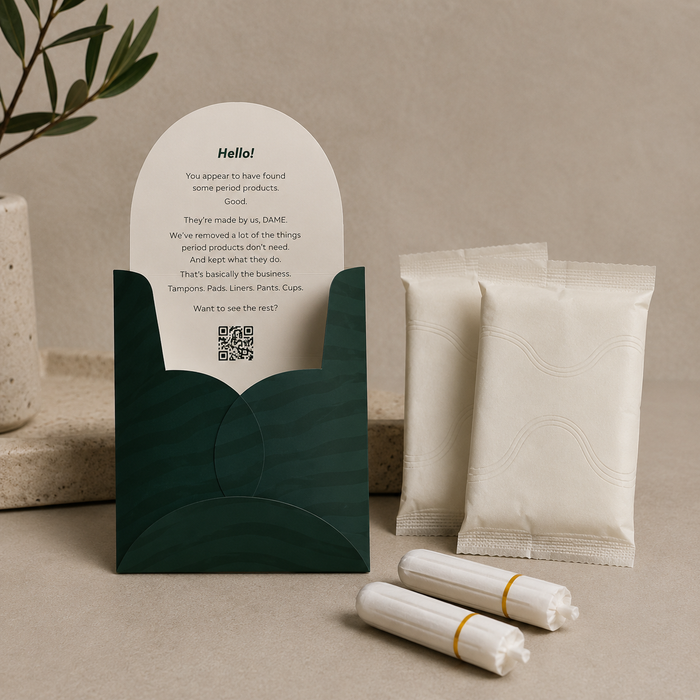The DAME Period Care Kit inside its branded tin
