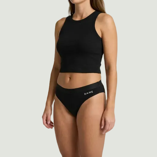 Model in black DAME Period pants on white background